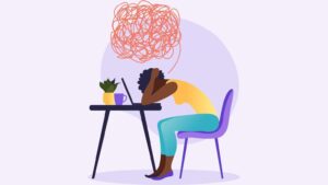 Person feeling exhausted and overwhelmed sitting in a gym environment, highlighting burnout, stress, and the impact of nutrition on energy and mental wellbeing.
